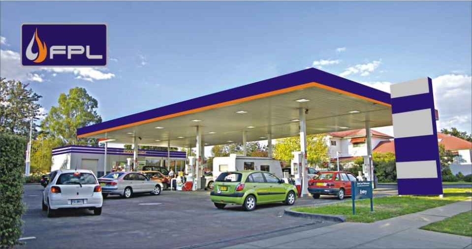 An FPL-branded fuel station with the flame logo and orange canopy trim